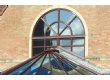 Arched frame above a Conservatory roof apex