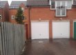 Two white Up and Over Garage Doors